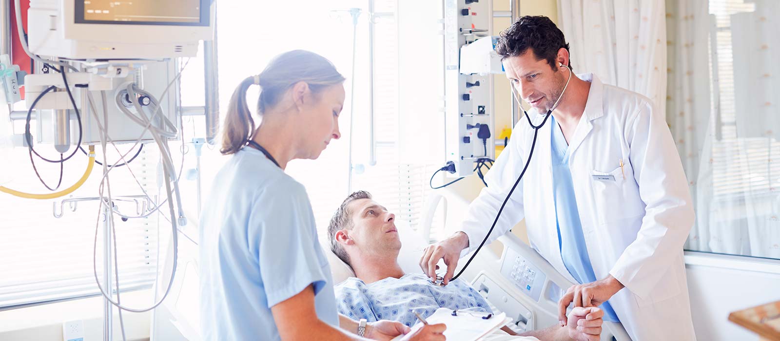 a doctor showing a patient something on the computer