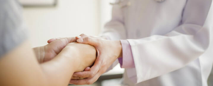Provider holding patient's hands