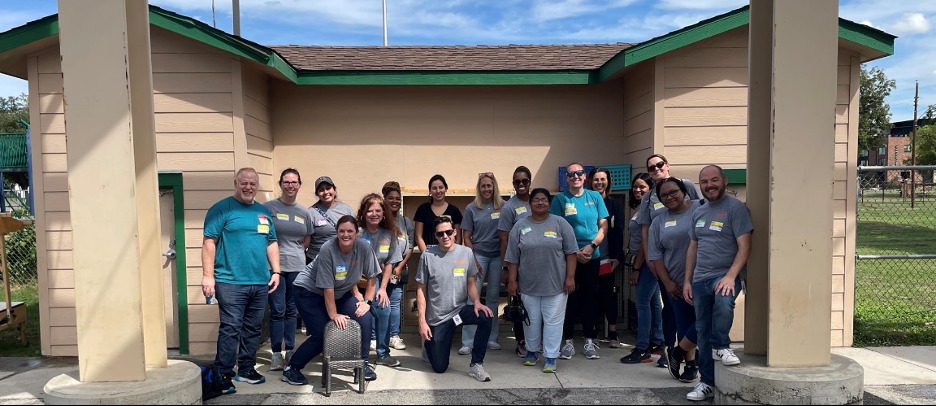 Joel Castillo (far left) and team in front of the Vogel shed they cleaned out for this year’s Community Day.