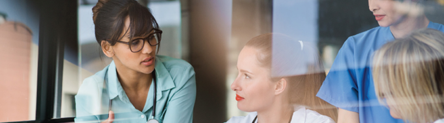 Healthcare workers reviewing executive insights