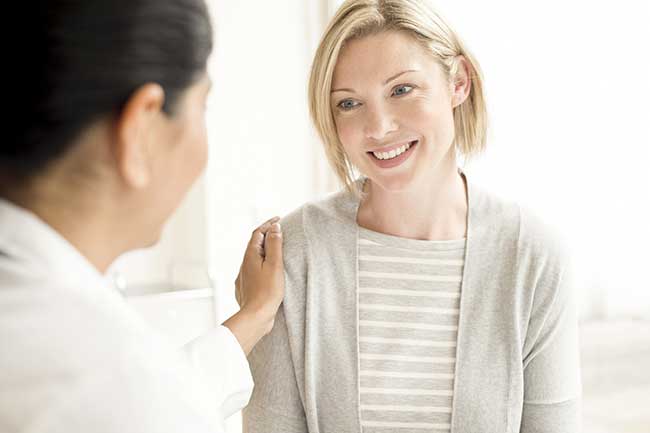Woman speaking to a doctor