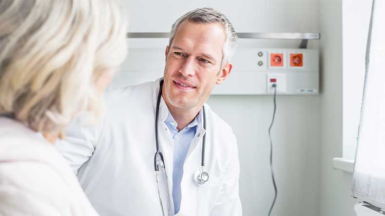 A doctor talking to a patient