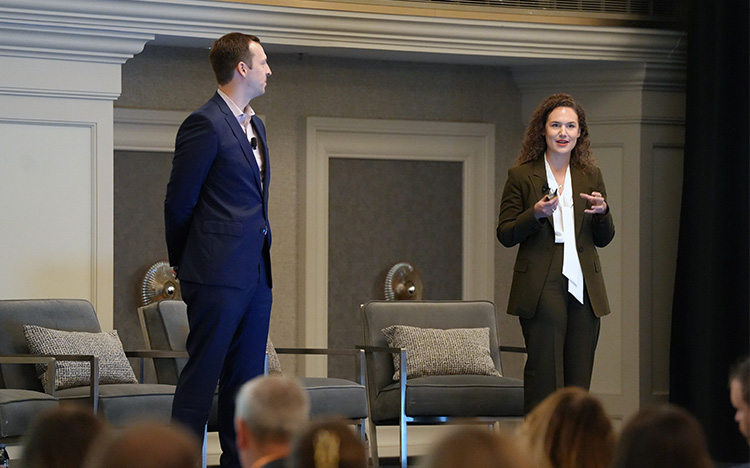 Speakers Tony Guth and Tori Richie on stage