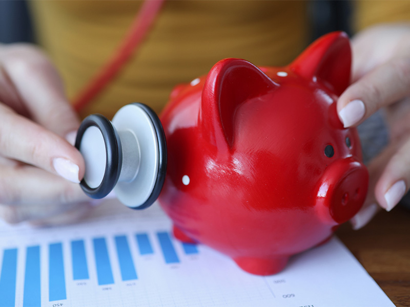 Piggy bank and stethoscope 